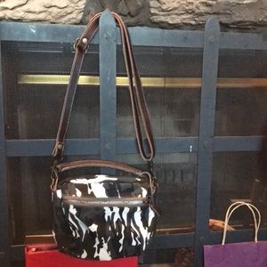 Purse with leather shoulder strap and hand strap in multi pattern